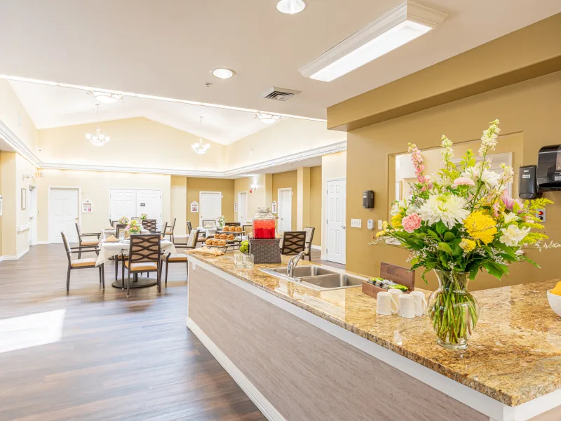 Bright common area with seating and floral decoration