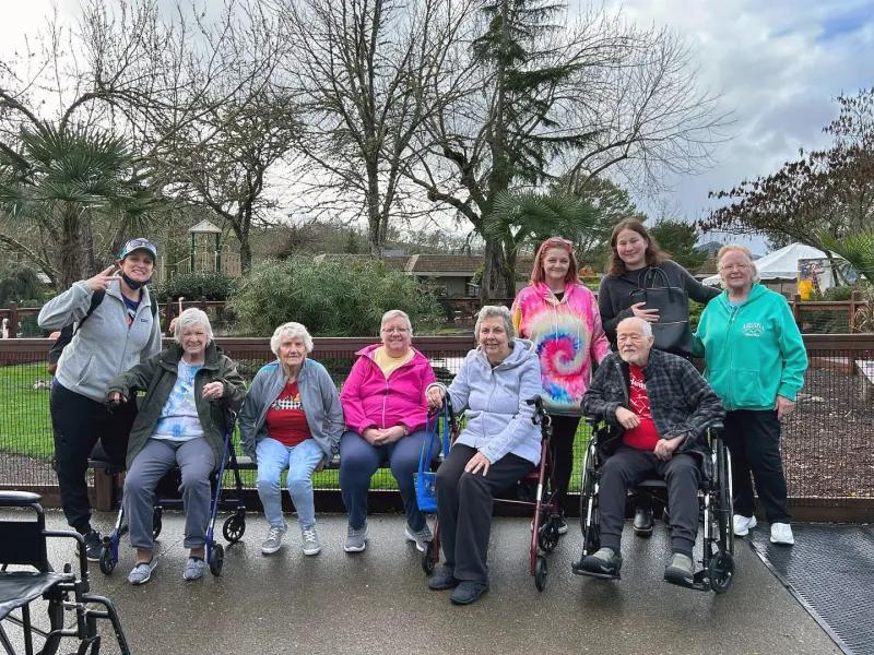 Residents posing together in an outdoor setting