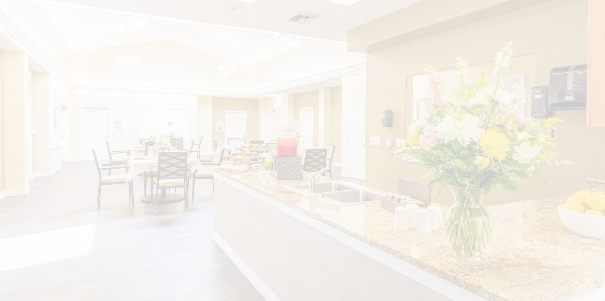 Bright dining room with floral centerpiece and refreshments