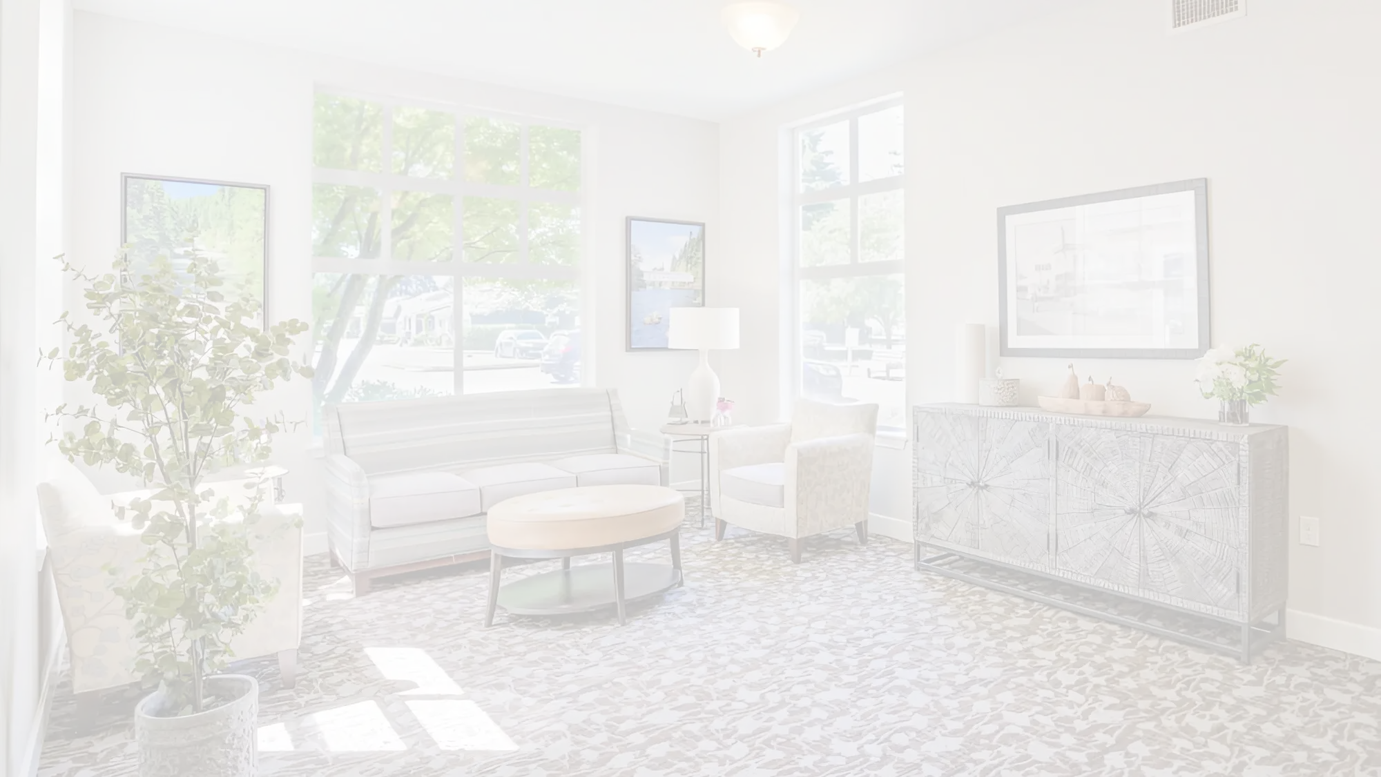Bright common area with seating and natural light
