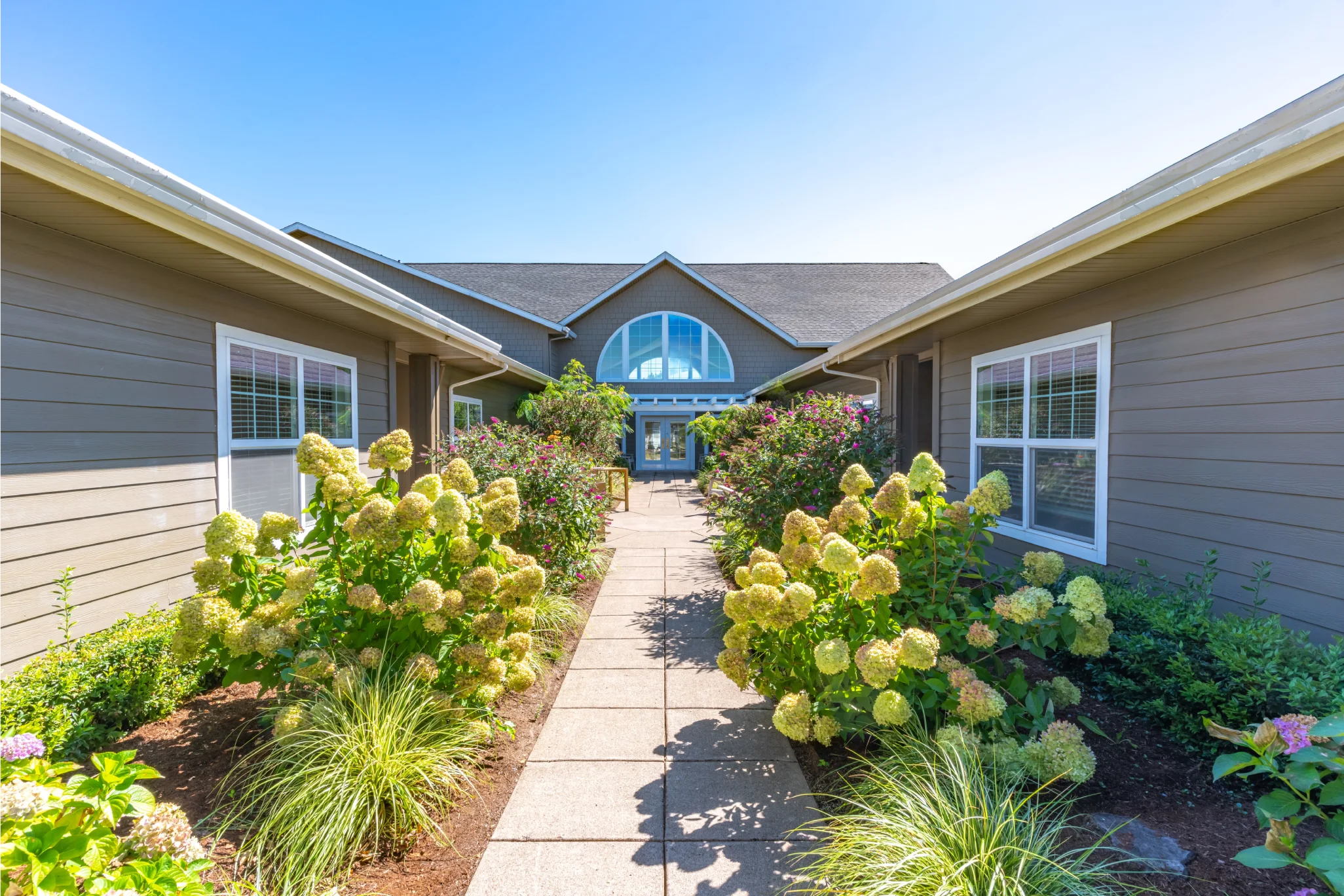 Pathway leading to the entrance of a senior living facility