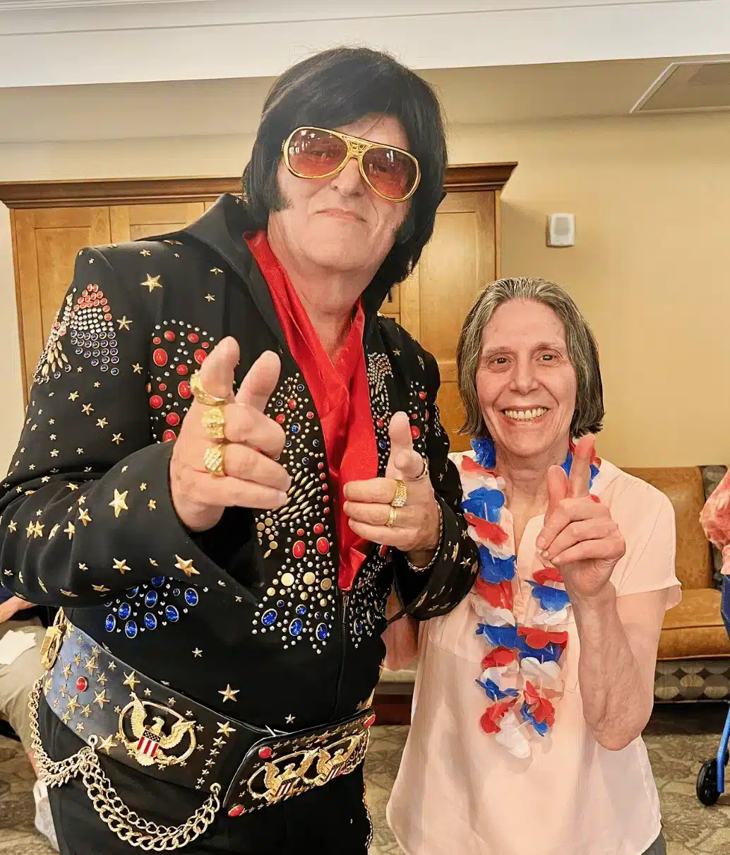 Resident enjoying performance with an entertainer