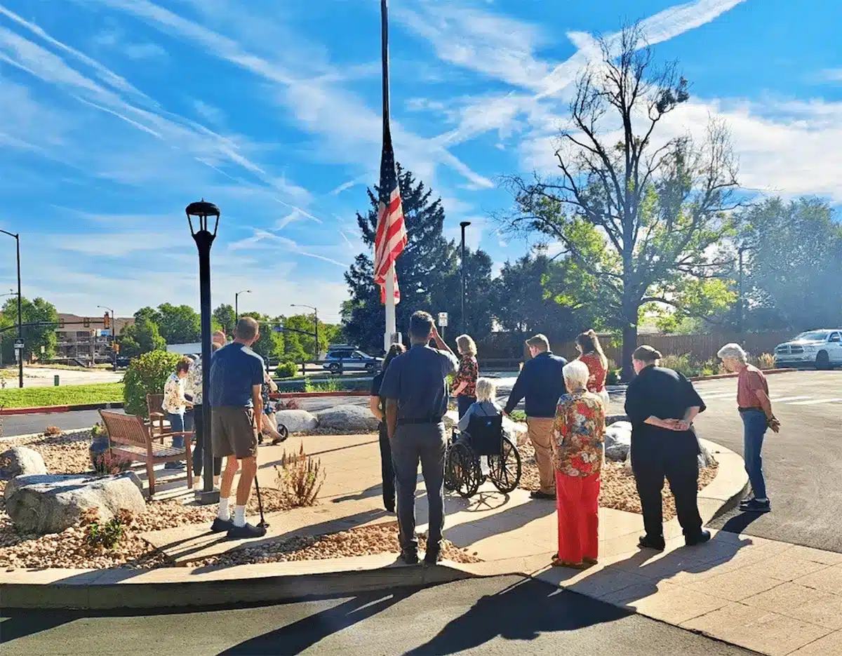 Residents and staff gathered outside for a flag ceremony