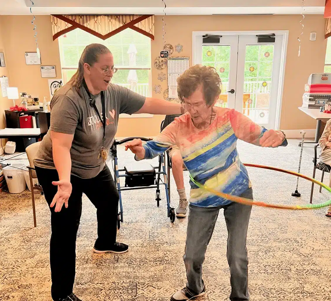 Residents participating in a hula hoop activity