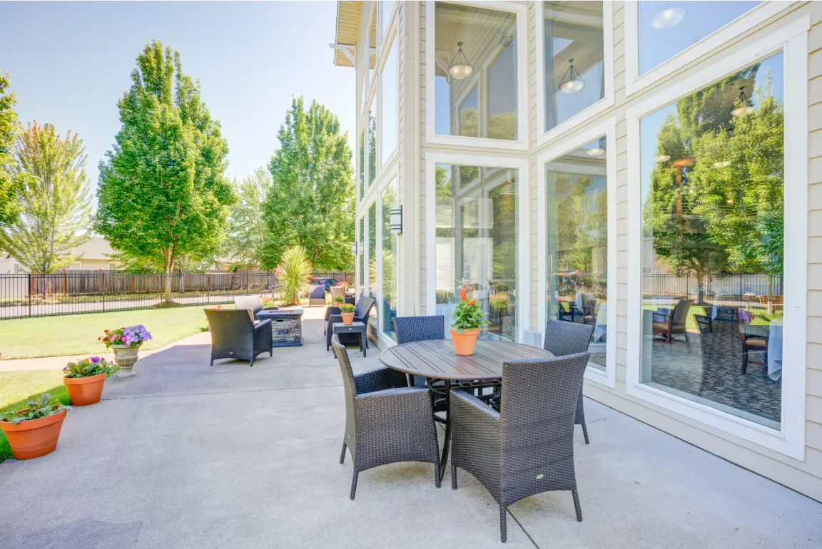 Outdoor seating area with tables and plants