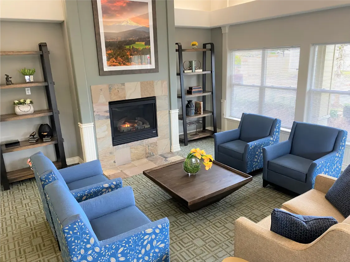 Common area with seating and fireplace