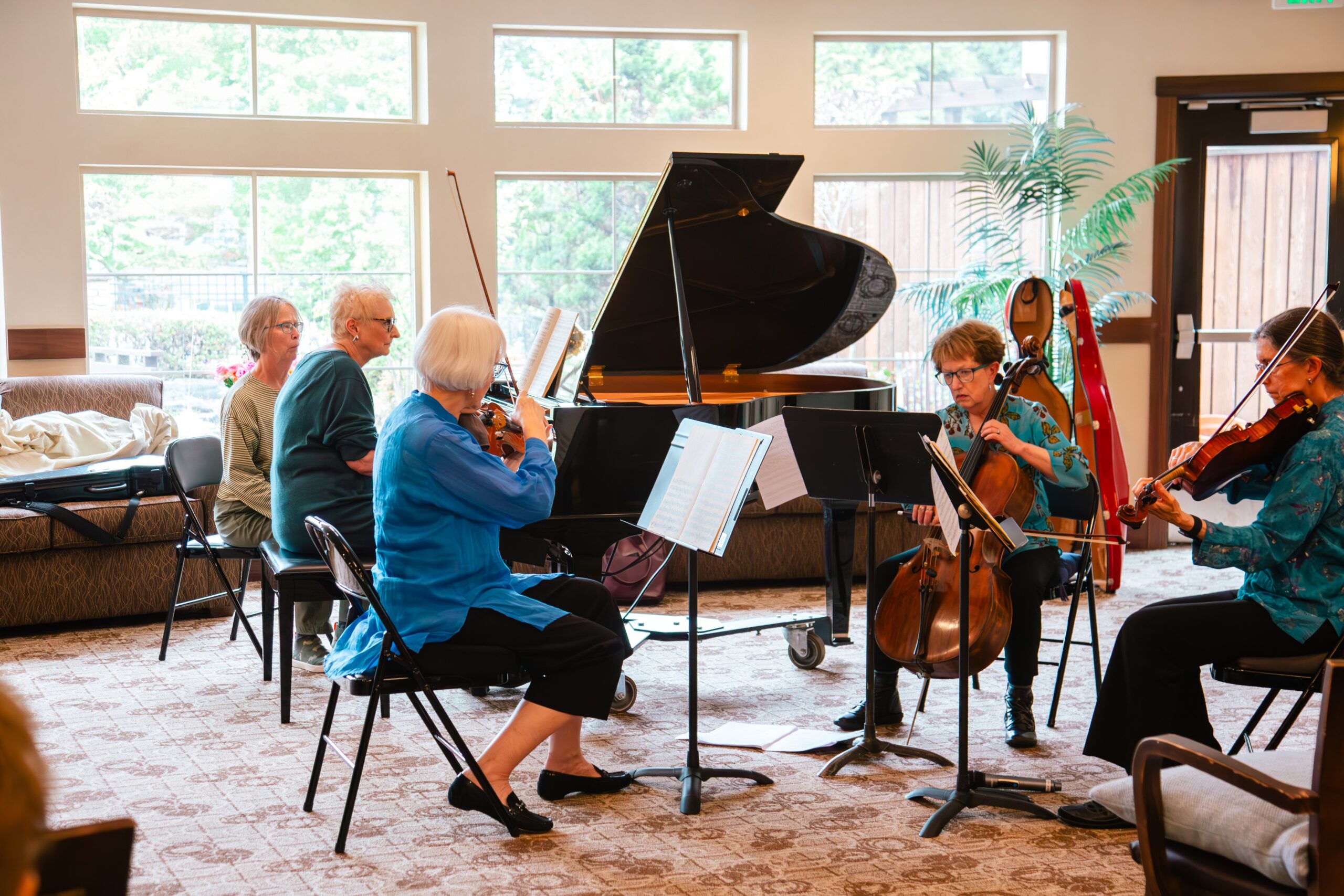 Residents enjoying a live music performance in a common area