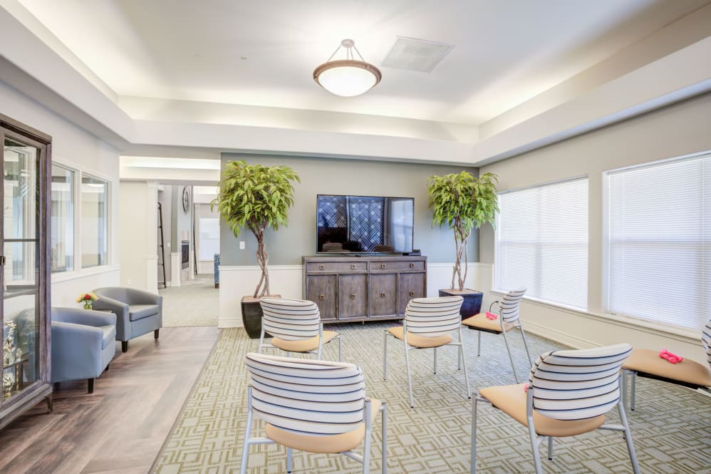 Interior common area with seating and a television