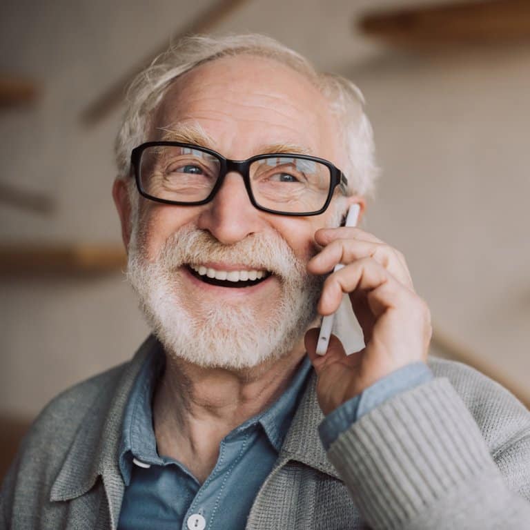 Smiling senior man talking on the phone