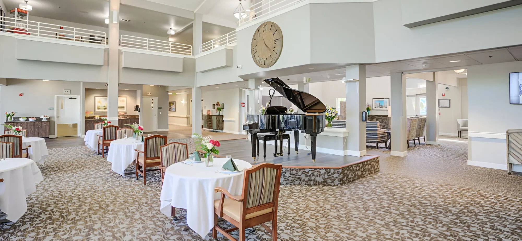 Interior view of a dining room with piano and tables
