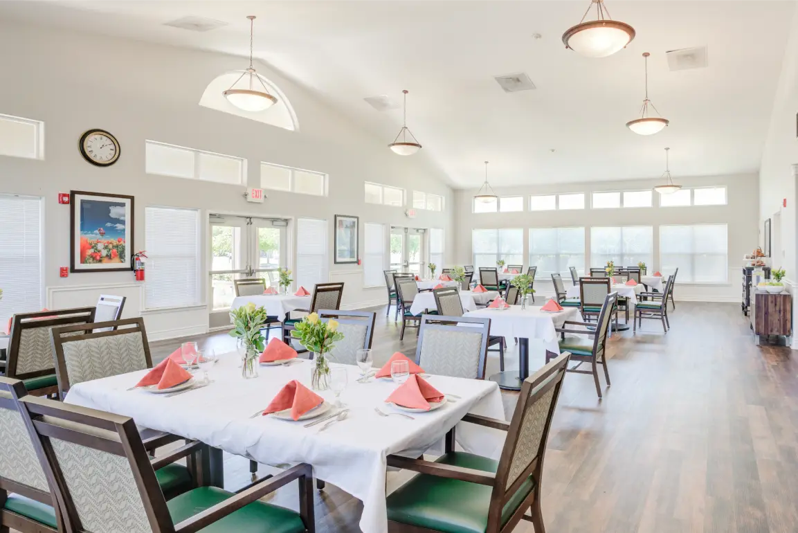Dining area with tables set for residents