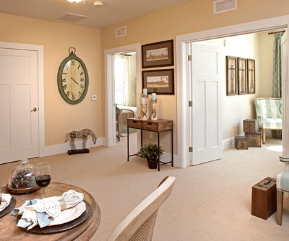 Bright interior of a resident room with decor and dining setup