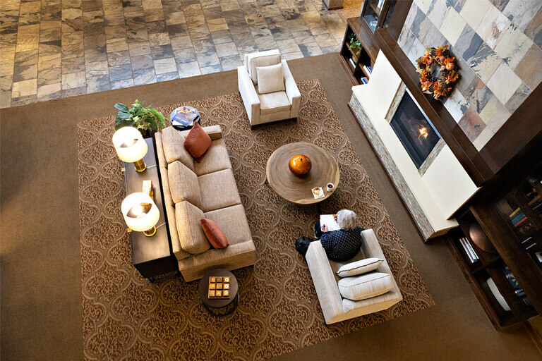 Cozy lobby area with a resident reading