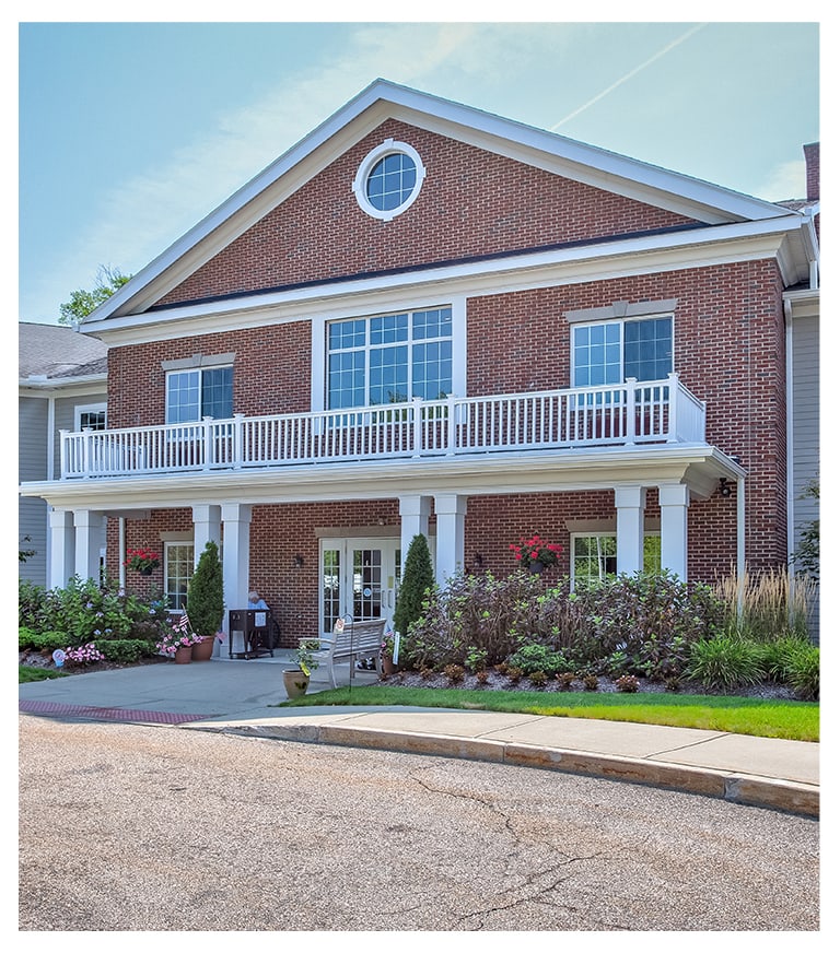 Exterior view of assisted living facility with porch