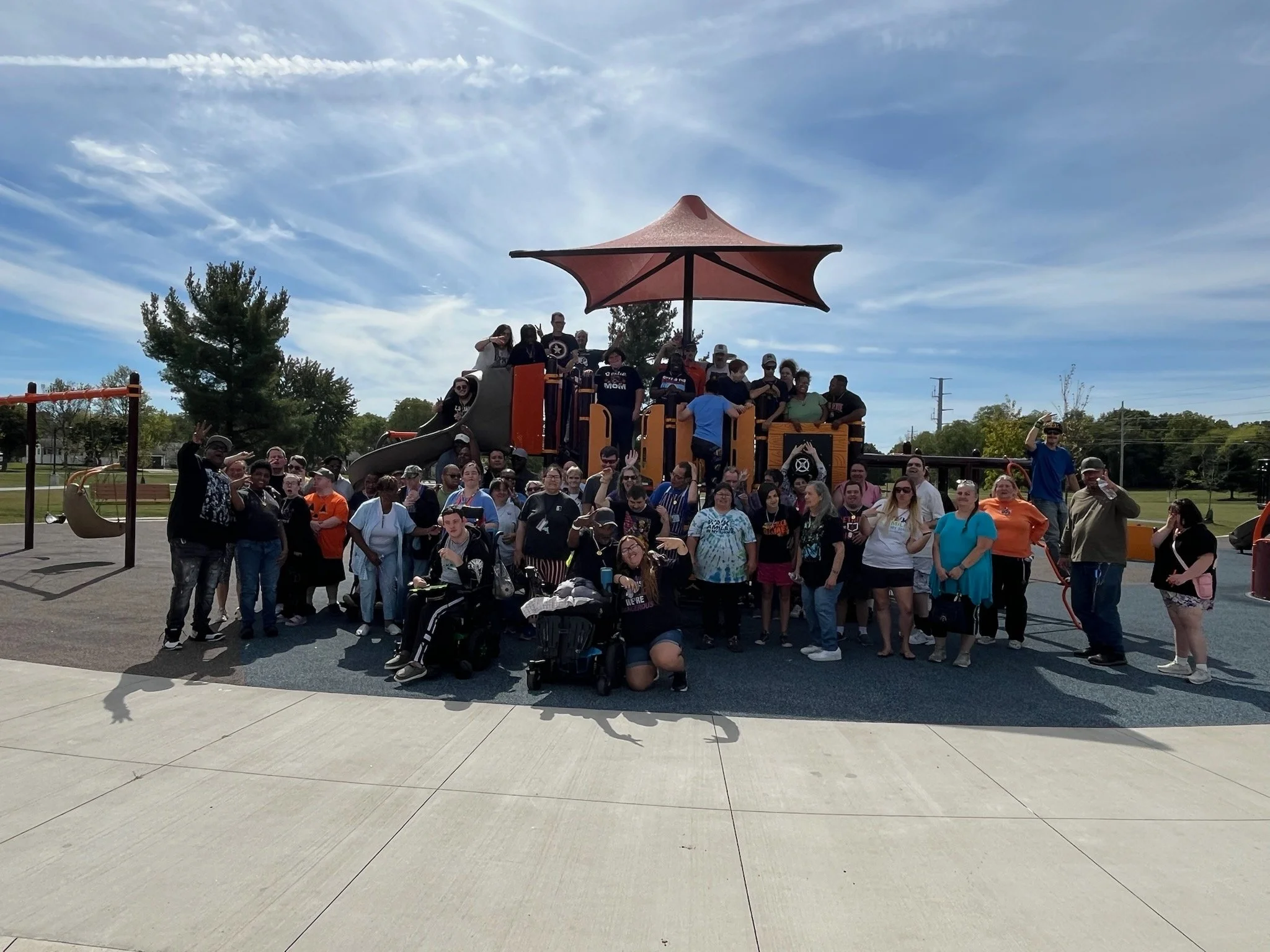 A large group of people at a playground.