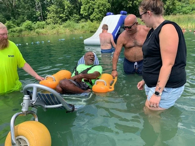 Residents enjoying an outdoor water activity.