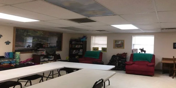 Common area with seating and bookshelves