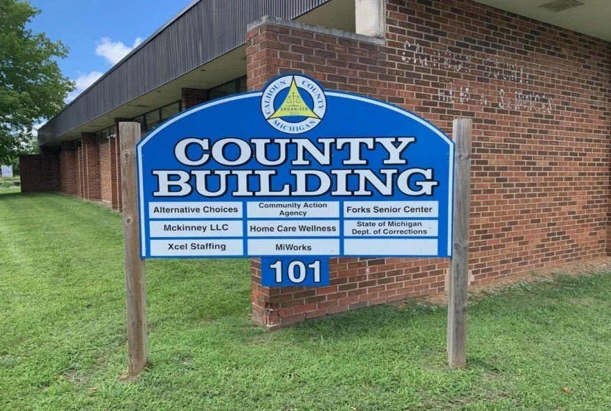 Sign for the County Building with various agency names