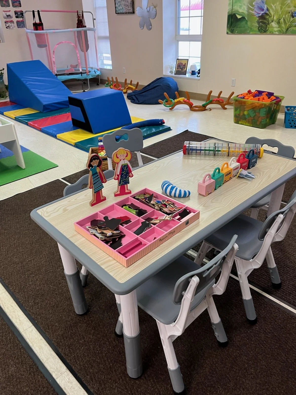 Children's activity area with colorful play materials.