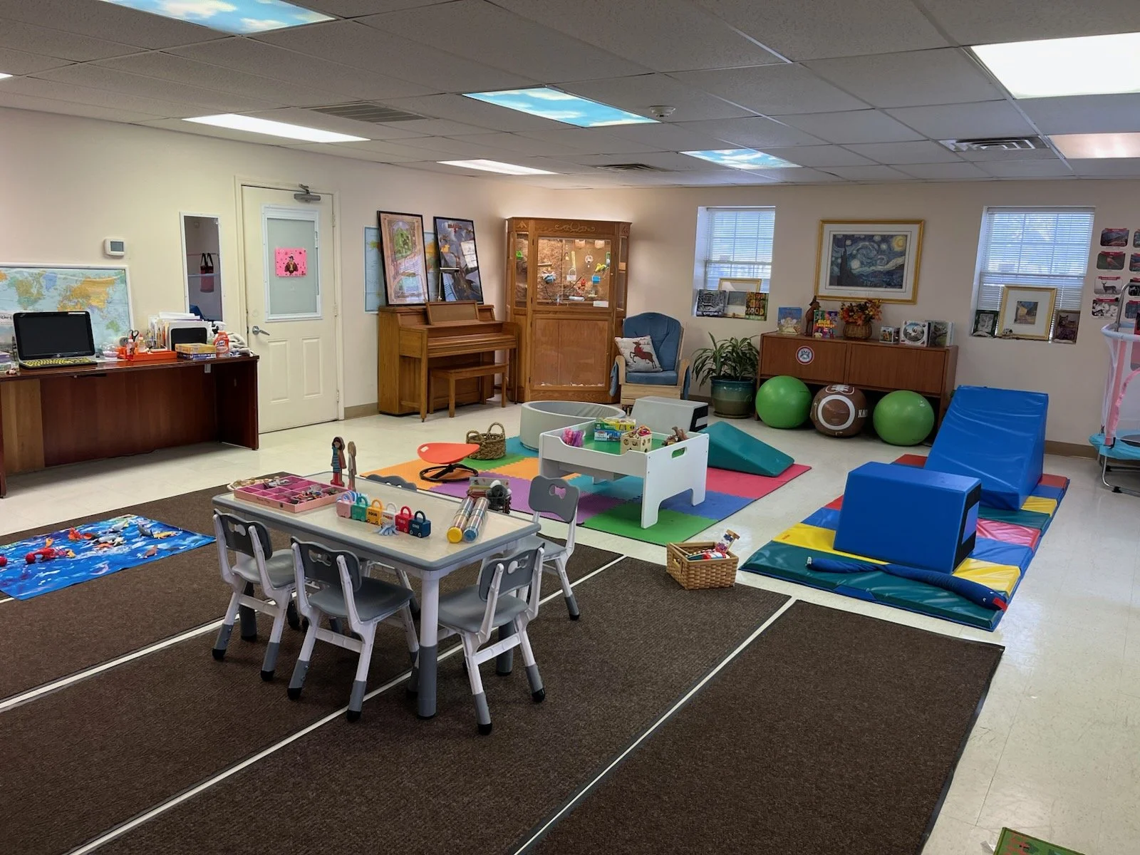 Interior play area with toys and exercise equipment.