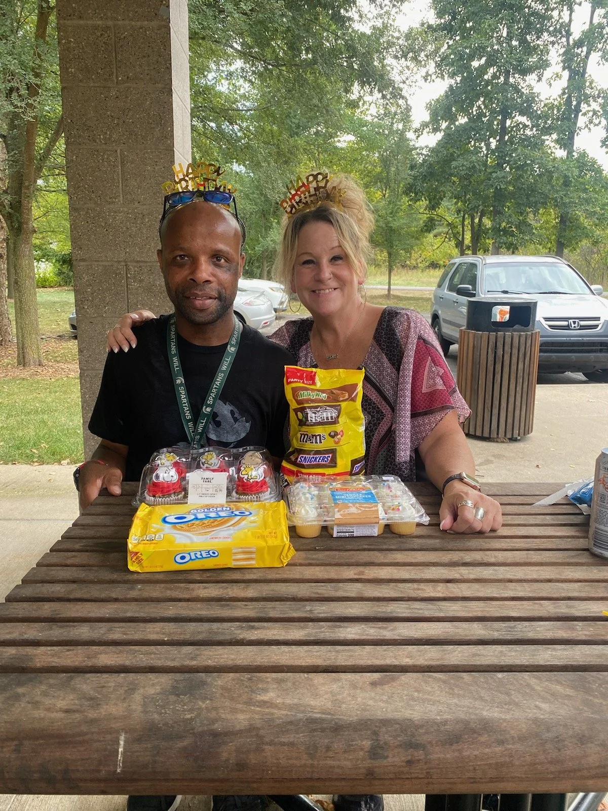 Two individuals enjoying snacks outside