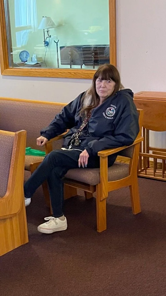 Woman seated in a common area of the facility