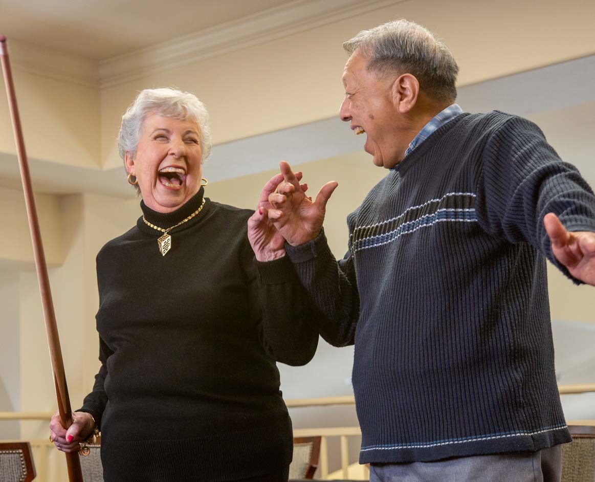 Residents enjoying a fun moment in the community area.