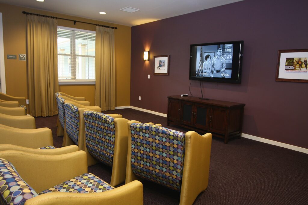 Common area with seating and television.