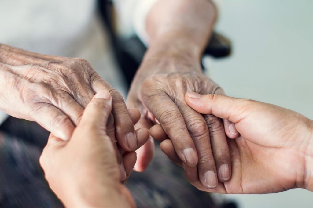 Close-up of hands showing connection and care