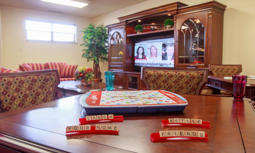 Common area with a game and cheerful decor.