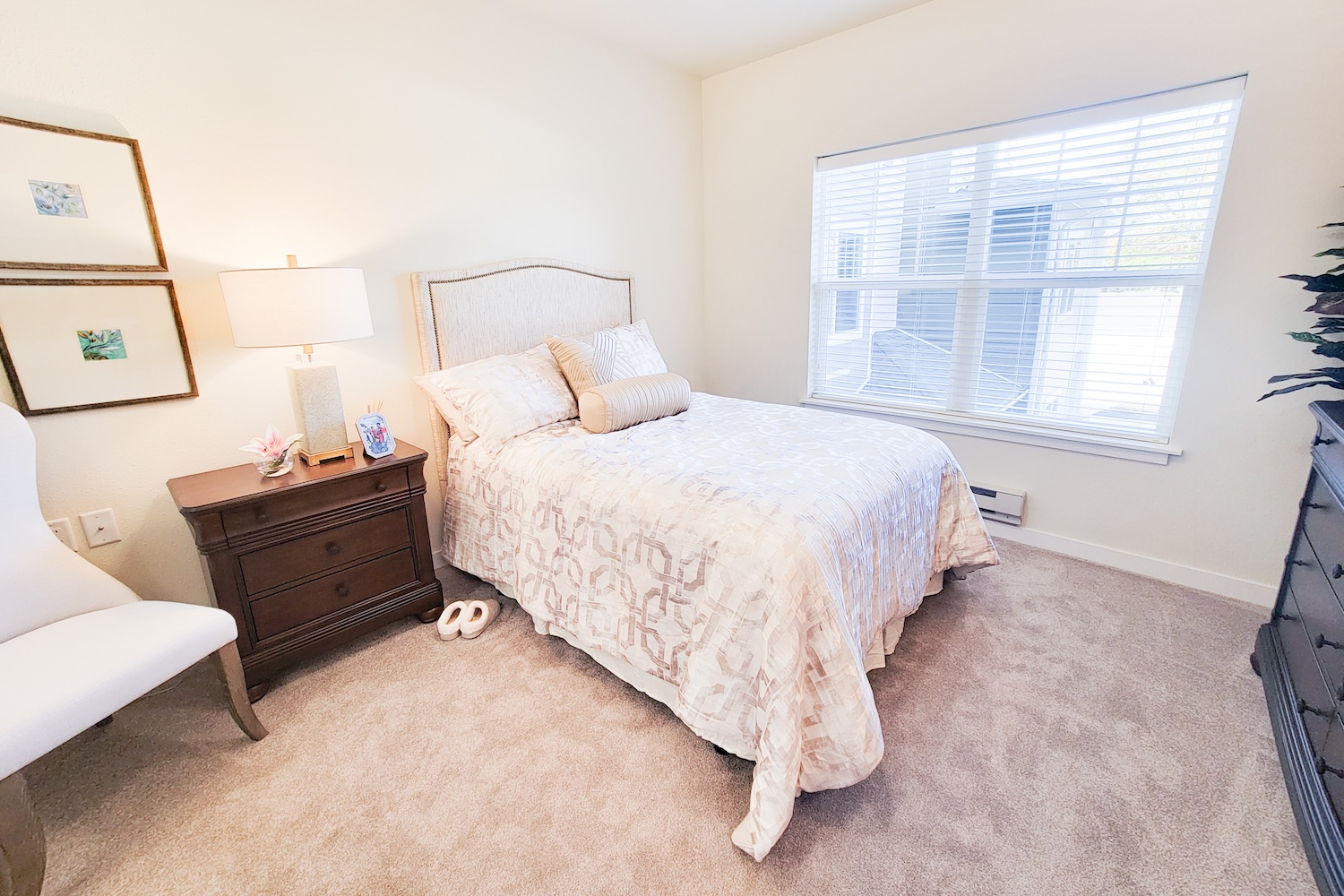 Cozy private resident room with a bed and nightstand.