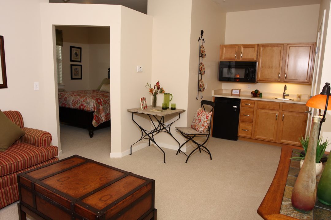Cozy interior of a resident room with kitchen area.