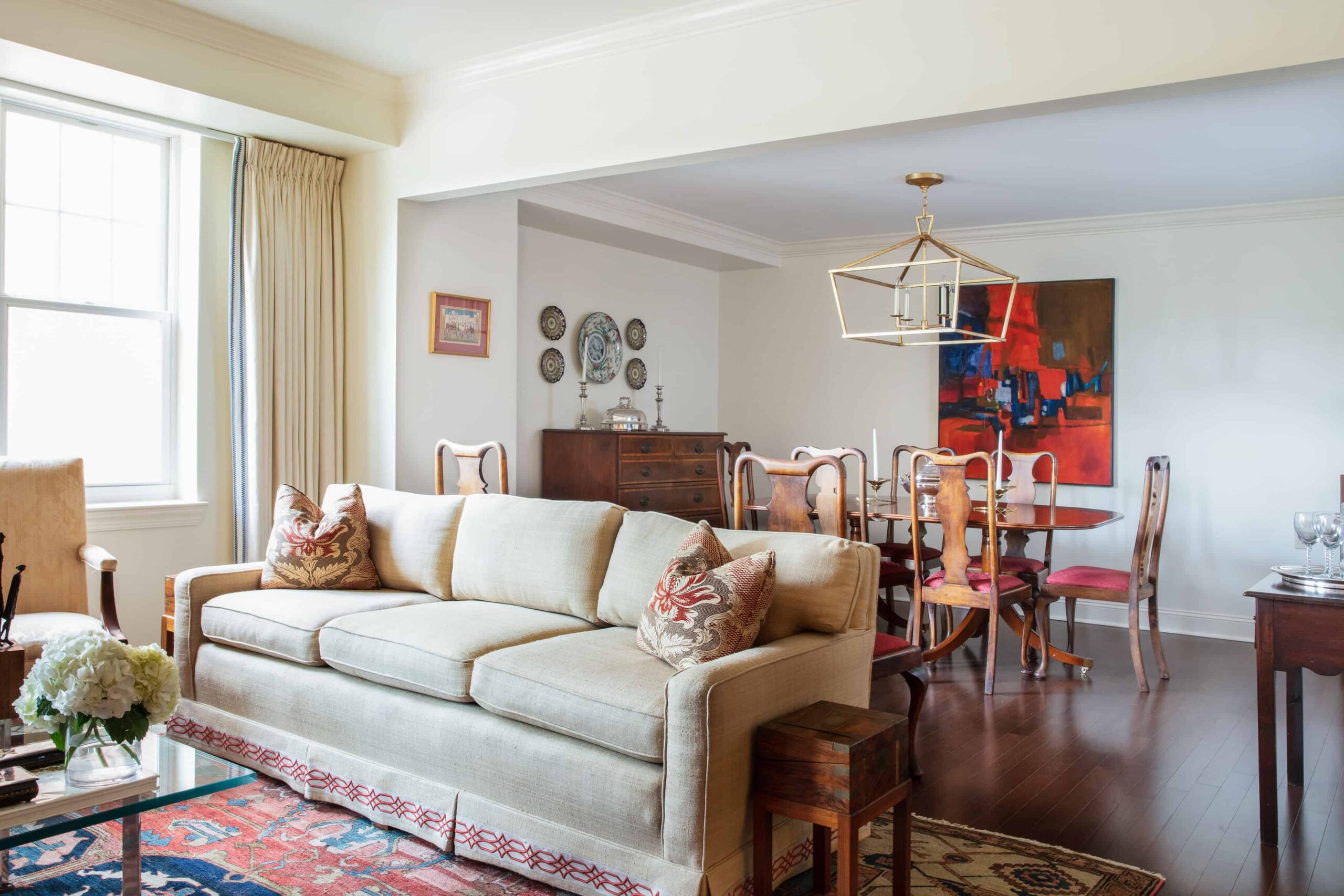 Bright and inviting common area with a sofa and dining table.