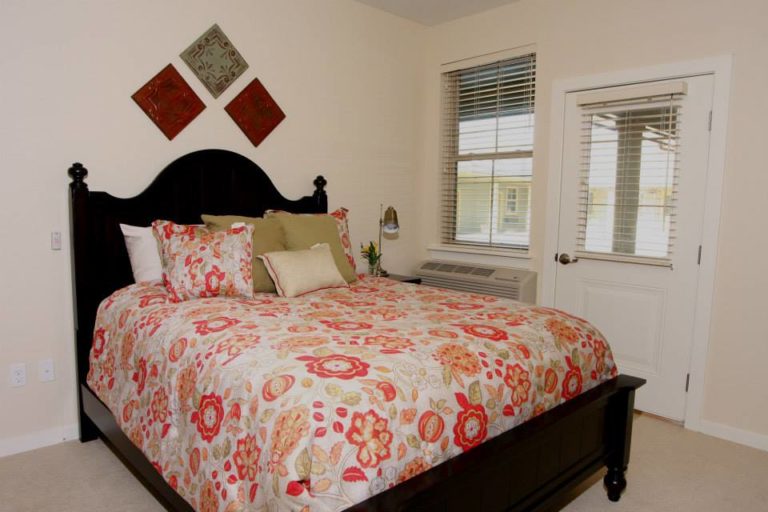 Cozy bedroom with floral bedding and window