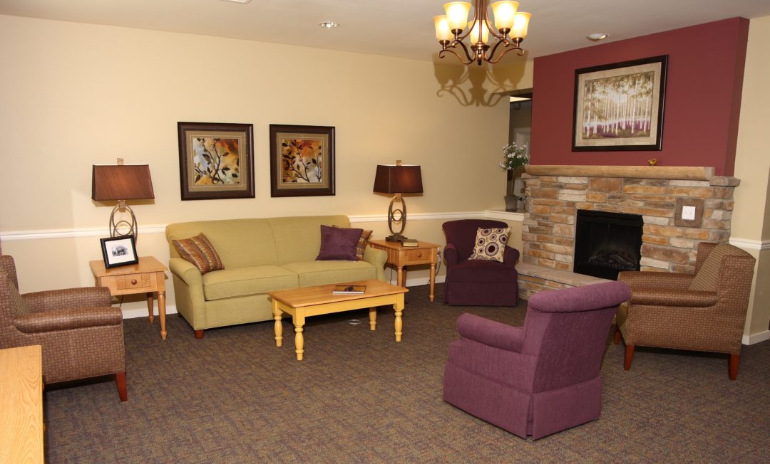 Cozy common area with seating and fireplace.