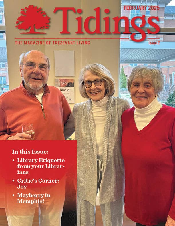 Three residents smiling in a common area.