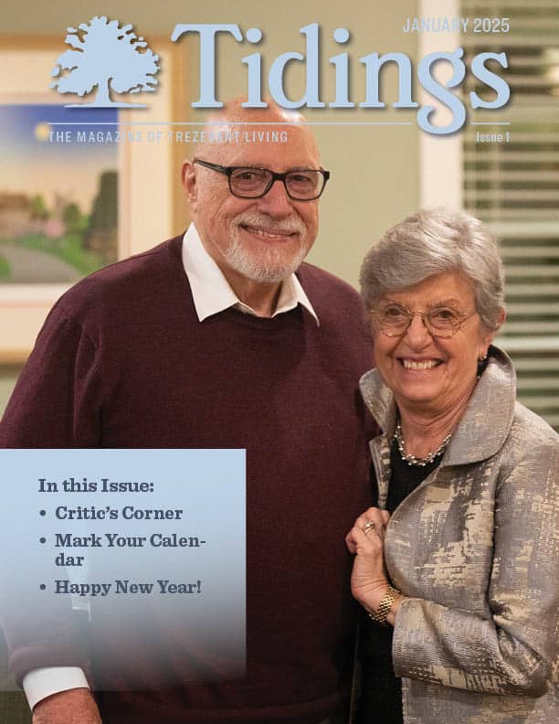 Residents smiling together in a common area.