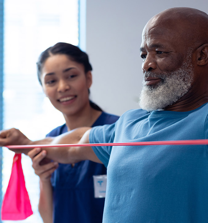 Senior resident engaging in therapy with staff