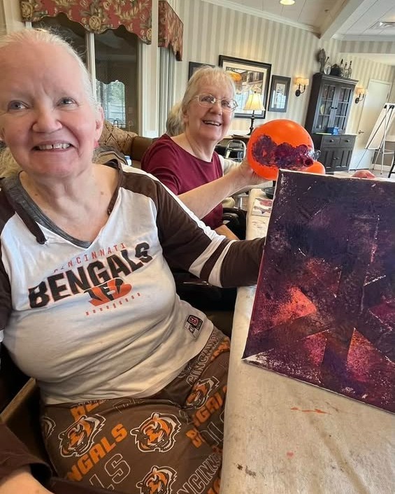 Residents enjoying a painting activity together.