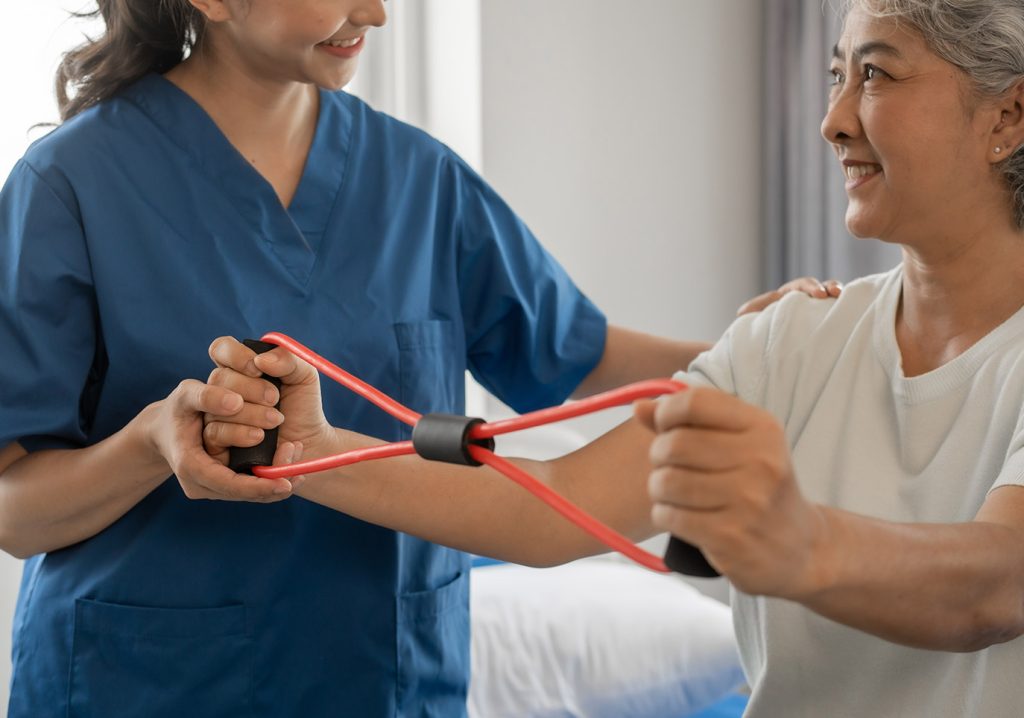 Staff assisting a resident with rehabilitation exercises.