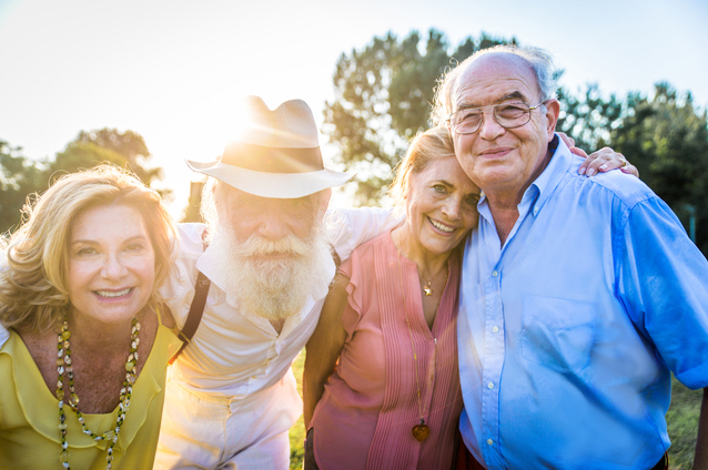 Group of smiling seniors enjoying time outdoors