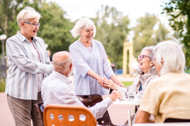 Residents engaging outdoors in a social activity.