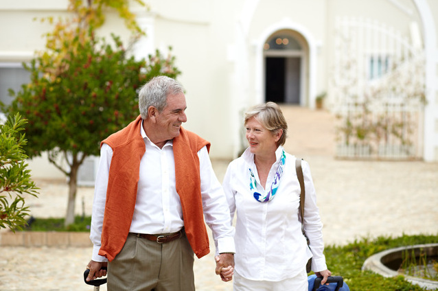 Couple walking together in an outdoor space