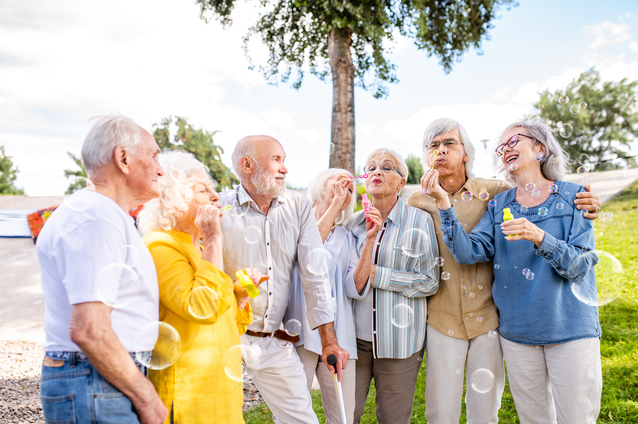 Residents enjoying bubble activity outdoors