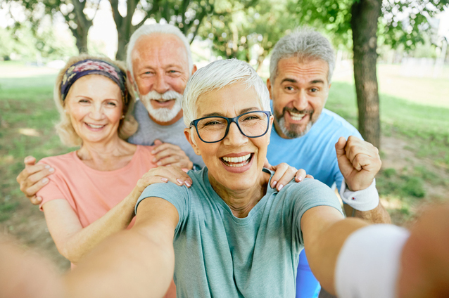 Group of smiling seniors enjoying the outdoors