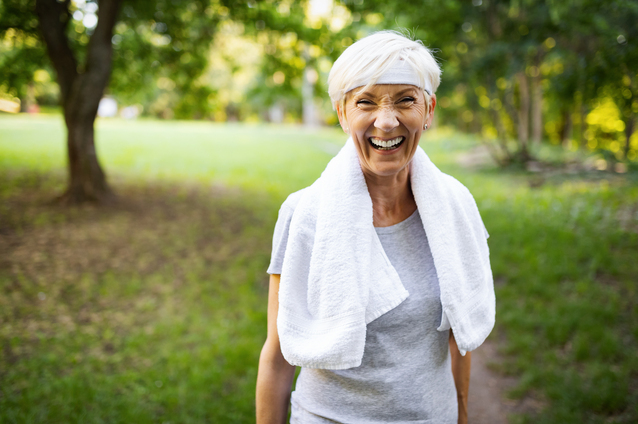 Active senior woman smiling outdoors