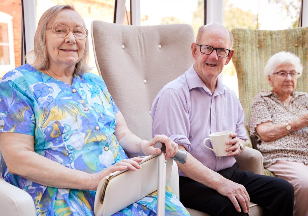 Three residents enjoying a common area.