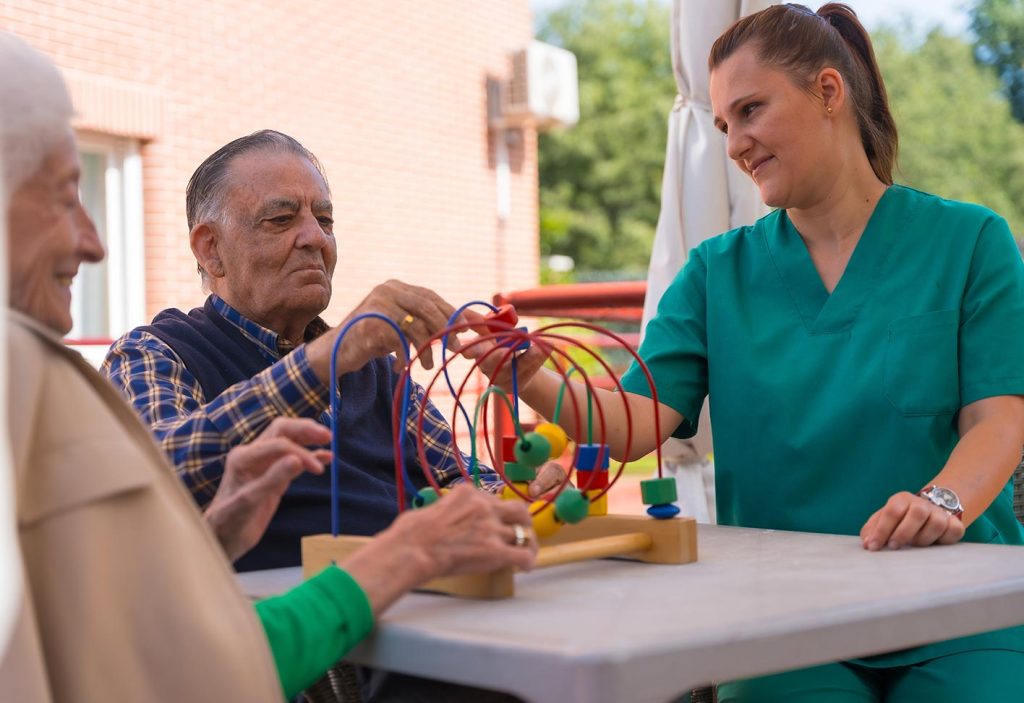 Residents engaging in a therapeutic activity outdoors.