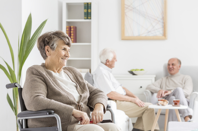Residents engaging in conversation in a common area.