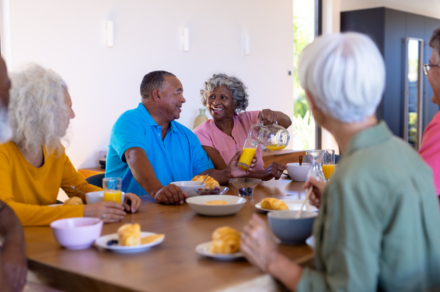 Residents enjoying a meal together in the dining area.